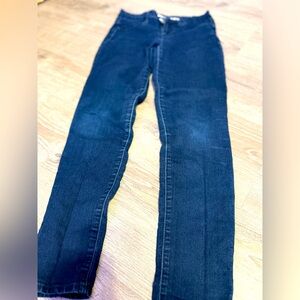 Calvin Klein Jeans branding on the waistband and a leather logo patch on the bac